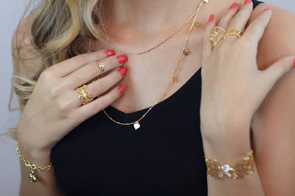 Close-up of elegant gold jewelry on a woman with stylish attire, perfect for fashion advertising and lifestyle blogs.